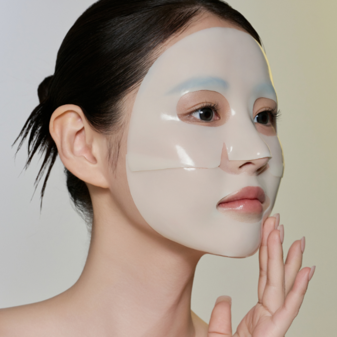 Person wearing a face mask with a neutral background