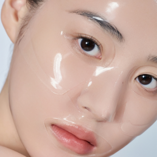 Close-up of a person's face with a clear gel patch on their face.